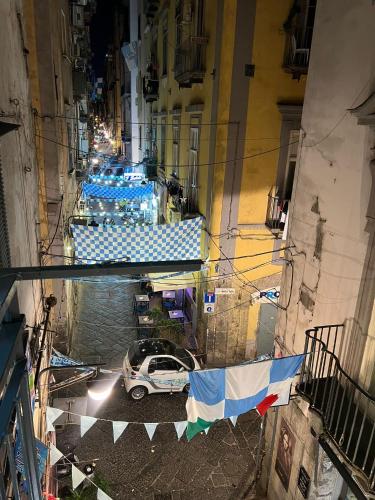 an overhead view of a street with a car parked in a alley at guest house terra mia in Naples