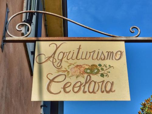 a sign for a caffeinated cecula on a building at Agriturismo Ceolara in Sommacampagna