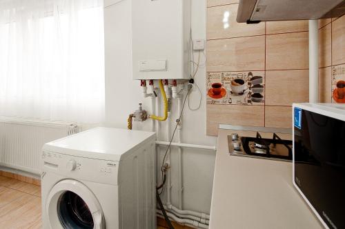 a washer and dryer in a kitchen with at Danube Residence in Galaţi