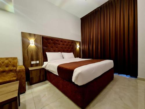 Postel nebo postele na pokoji v ubytování New Dream Plaza Hotel Apartment