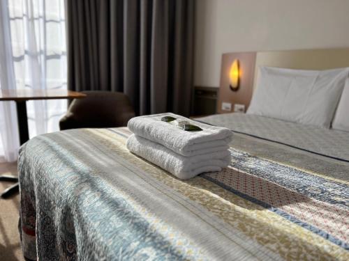 Postel nebo postele na pokoji v ubytování Motel Margeurita