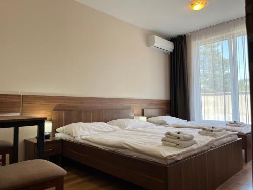 Postel nebo postele na pokoji v ubytování Hotel Aréna