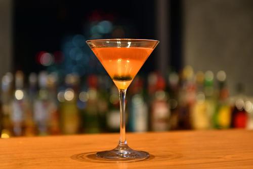 a drink in a glass sitting on a table at Nagoya Prince Hotel Sky Tower in Nagoya