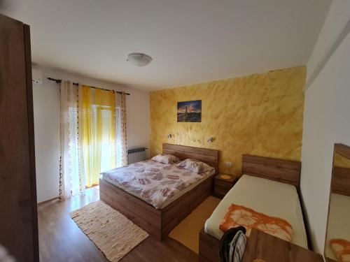 Postel nebo postele na pokoji v ubytování Villa Rab Robert