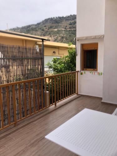 a balcony with a view of a building at Lissos Rooms Sougia in Sougia