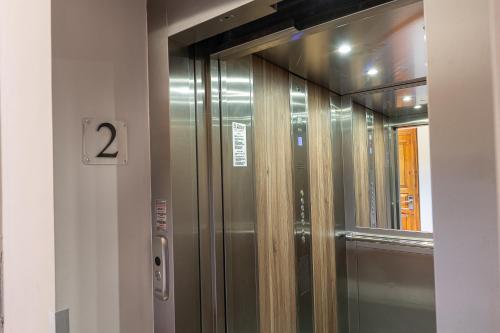 a elevator in a building with the number two at Golden View in Poros