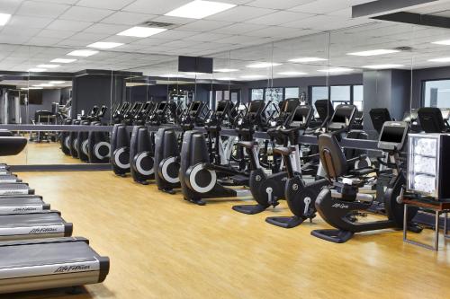a gym with rows of treadmills and machines at Renaissance Nashville Hotel in Nashville