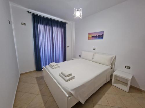 Ένα ή περισσότερα κρεβάτια σε δωμάτιο στο Villa White