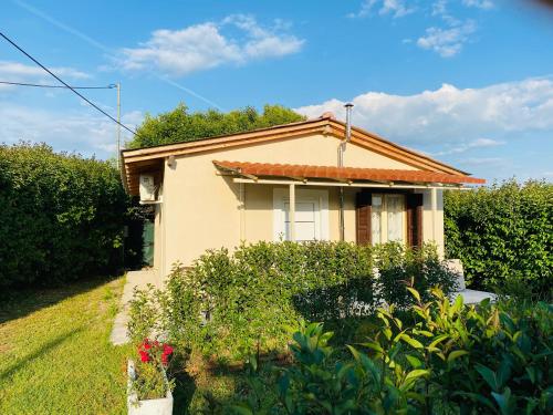 a small house with a garden in front of it at The mansion of Dionisos and Dimitras 5 in Linariá