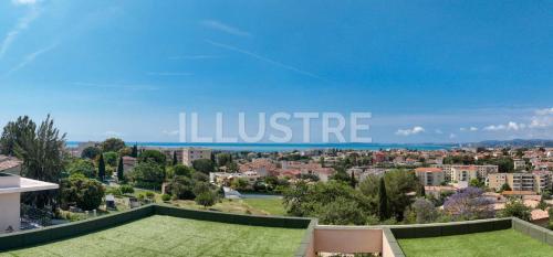 a view of the city from the balcony of a house at Villa Vue Mer, Piscine & Plage à 6Min in Cagnes-sur-Mer