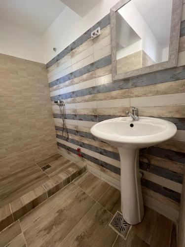 a bathroom with a sink and a shower at Complex Marea Neagra in Eforie Nord