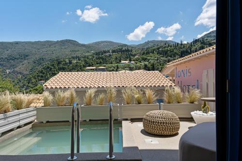 a view of a house with a swimming pool at Tellion Suites in Lefkada Town