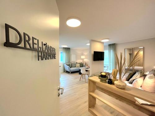 a living room with a door open to a living room at Maison Saarschleife Mettlach in Mettlach