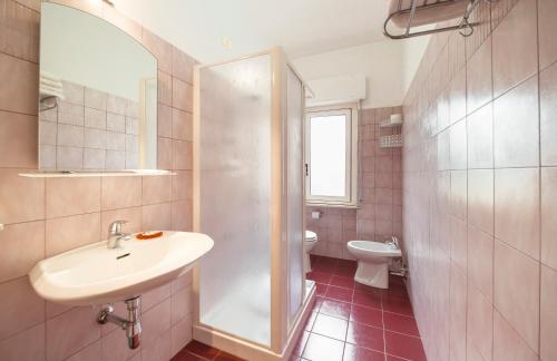 a bathroom with a sink and a toilet at Albergo Il Veliero in Pineto