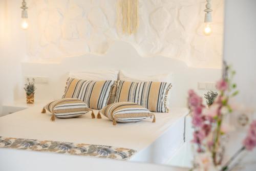a pair of pillows on a shelf in a room at Keti Kapri in Plaka