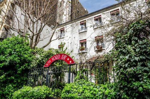Un jardín fuera de Nord Est Hotel