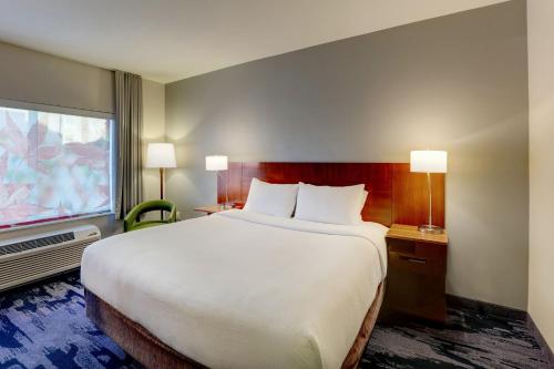 a hotel room with a large bed and a window at Fairfield Inn & Suites by Marriott Fort Worth I-30 West Near NAS JRB in Fort Worth