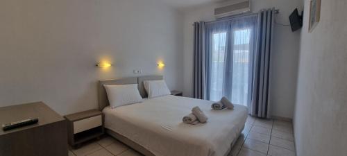 Ένα ή περισσότερα κρεβάτια σε δωμάτιο στο Horizon Resort 