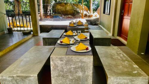 a row of tables with plates of food on them at Spring Villas Kandy in Kandy