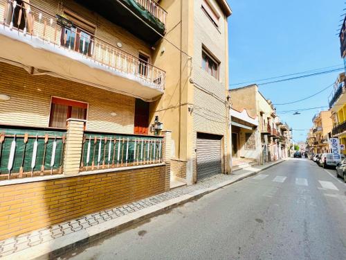 an empty street next to a building at Domus Aurea in Isola delle Femmine