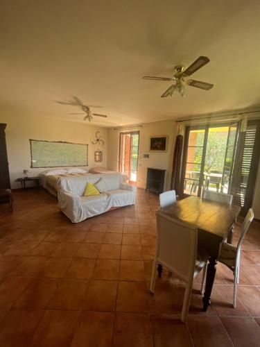 a living room with a bed and a table at Fattoria Antonella in San Gimignano