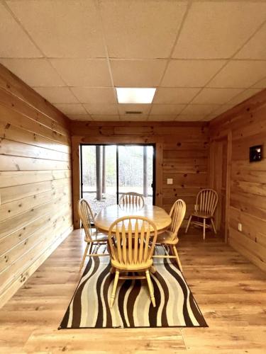 a dining room with a table and chairs at Grand View Home with 360 Degree Mountain View in Tellico Plains