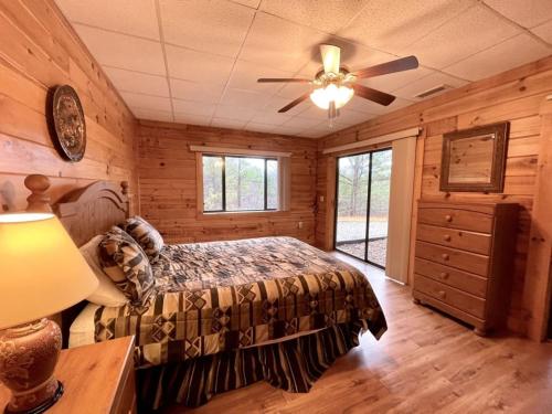 a bedroom with a bed and a ceiling fan at Grand View Home with 360 Degree Mountain View in Tellico Plains