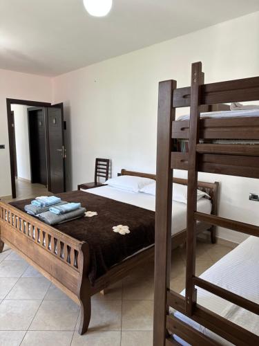 a bedroom with two bunk beds and a ladder at Horizonti Blu in Shëngjin
