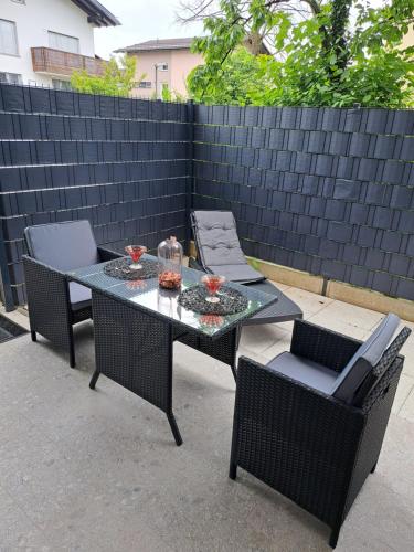 a table and chairs on a patio at Stunning new apartment with free parking near city centre in Ljubljana