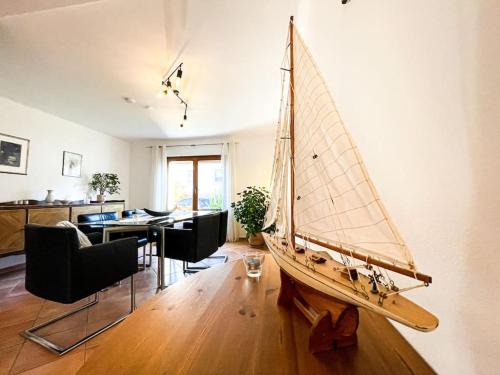 a wooden sail boat on display in a living room at Wohlfühloase für 10 Personen in Rödermark