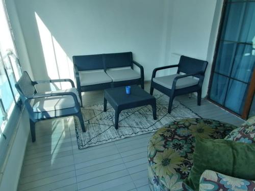 a living room with chairs and a couch and a table at Eryaman, Wide Luxury Concept in Etimesut