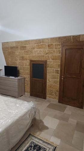 Postel nebo postele na pokoji v ubytování dimora arcobaleno