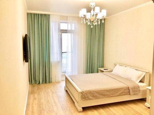 Posteľ alebo postele v izbe v ubytovaní Arcadia 2nd Pearl Apartment