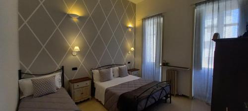 En eller flere senge i et værelse på B&B Acanto Lecce