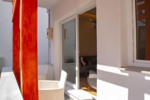 a room with a window and a living room at Cozy apartment with balcony in Bodrum City