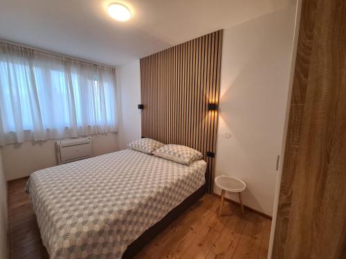 Postel nebo postele na pokoji v ubytování Apartment Skadenca