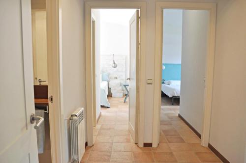 a hallway with a door leading to a bedroom at Villa Torrent Costa Brava, con piscina privada! in Pals