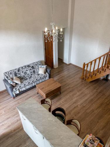 a living room with a couch and a table at Center Apartment 3 Rooms in Tbilisi City