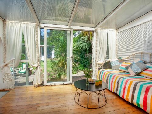 a living room with a couch and a table at Teign Retreat in Teignmouth