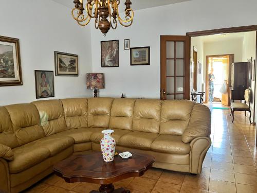 a living room with a couch and a table at Casa Riotorto in Riotorto