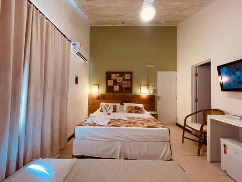 Cama o camas de una habitación en Pousada Tatuapara