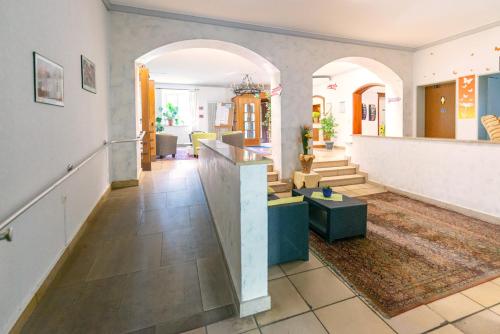 a large living room with a counter and a lobby at Jugendhotel Nürnberg in Nürnberg