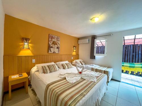 Cama o camas de una habitación en Pousada Tatuapara