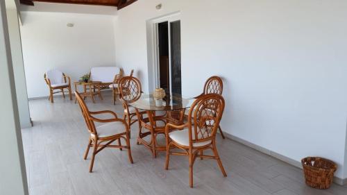 a dining room with a table and chairs at Kerasies Studios in Patitiri