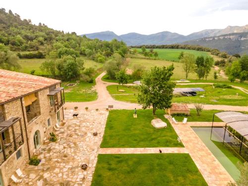 an aerial view of the garden of a house at ECOTurisme Can Buch HOTEL in Sant Aniol de Finestras