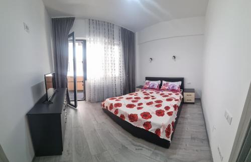 Кровать или кровати в номере Apartament mihaela