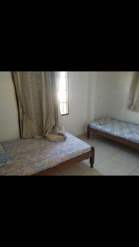 Katil atau katil-katil dalam bilik di Amar ak house