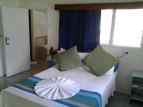 Katil atau katil-katil dalam bilik di Daku Resort