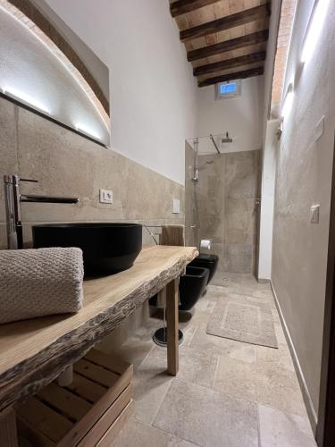 a bathroom with two sinks and a shower at The Loft By Birillo in Poggibonsi