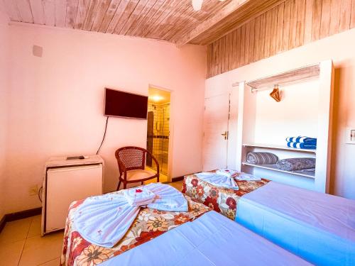 Cama o camas de una habitación en Pousada Tatuapara